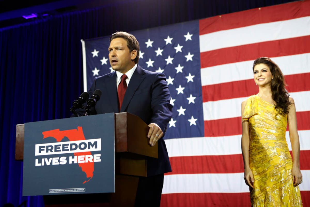 Florida Gov. Ron DeSantis gives a victory speech after defeating Democratic gubernatorial candidate Rep. Charlie Crist while his wife Casey DeSantis looks on during his election night watch party. (Image Source: Getty Images | Photo by Octavio Jones)