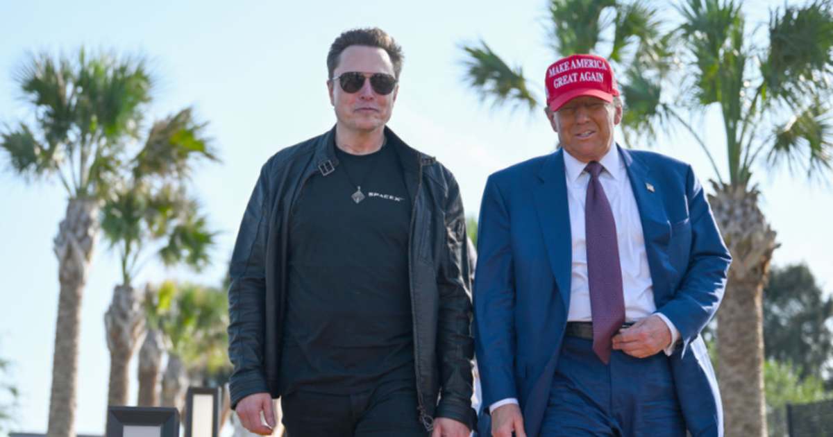Donald Trump greets Elon Musk on November 19, 2024, in Brownsville, Texas.  (Image Source: Getty Images | Photo By Brandon Bell)