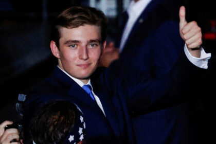 Barron Trump Making A Thumbs-Up Gesture