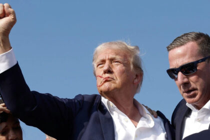Donald Trump with his fist raised moments after he was shot at the Pennsylvania rally and Sean Curran