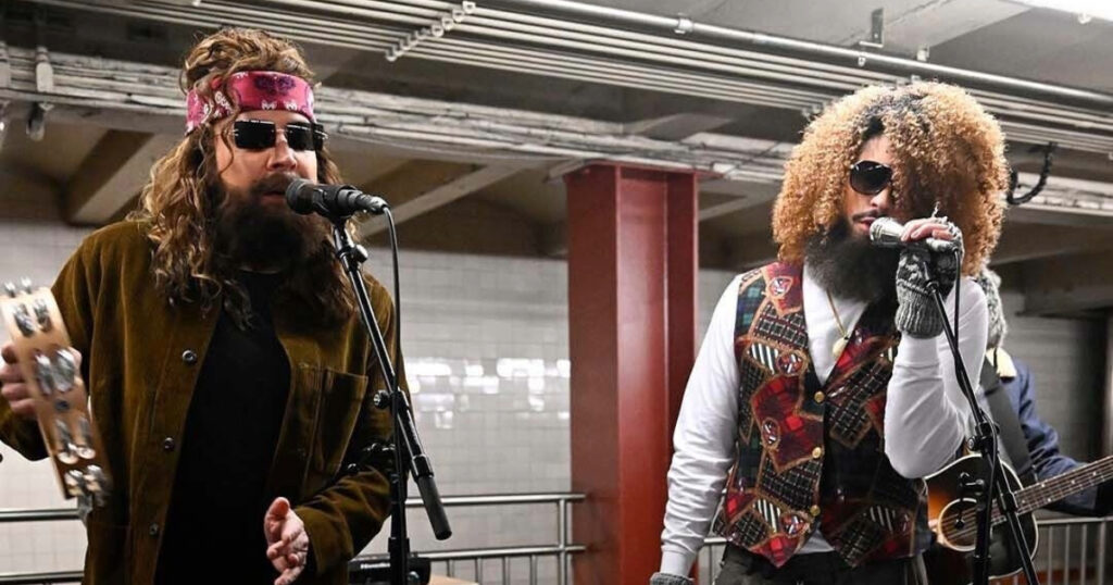 Jimmy Fallon (L) and Bad Bunny perform at a subway station in New York.