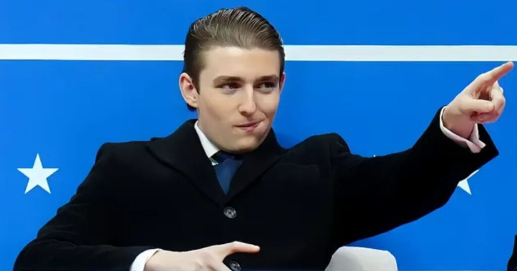 Barron Trump gestures when he arrives at Capital One Arena.