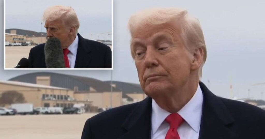 Donald Trump was struck in the face by a boom microphone during a press huddle at Joint Base Andrews in Maryland on Friday