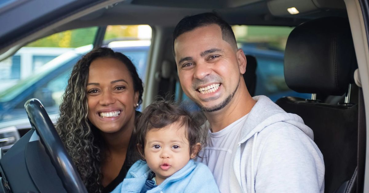 Parents with their infant in a car