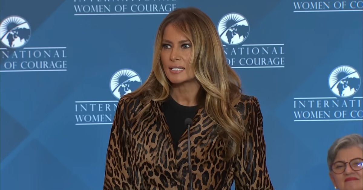 Melania Trump standing at a podium, speaking at the International Women of Courage awards