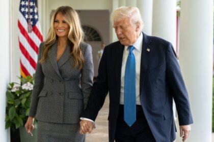 Donald Trump and Melania Trump behind the door