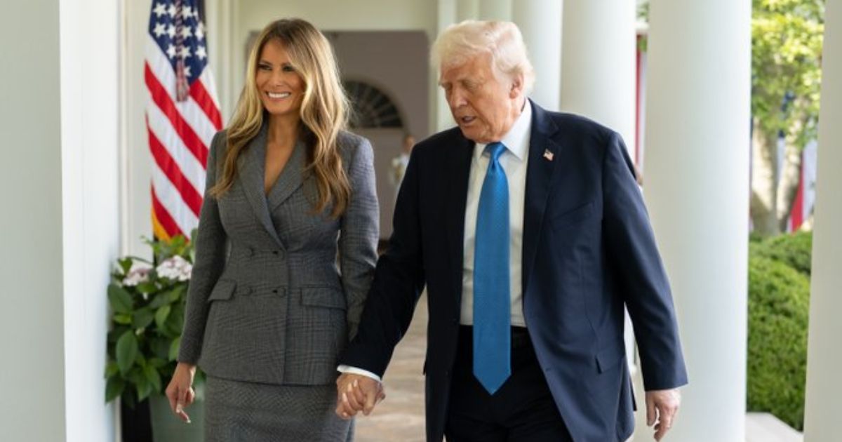 Donald Trump and Melania Trump behind the door