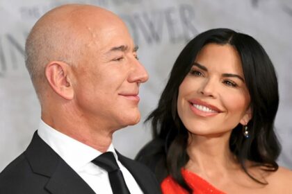 Jeff Bezos and Lauren Sánchez smiling at a formal event, preparing for wedding