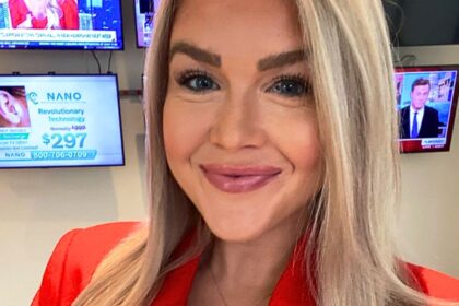 Karoline Leavitt wearing red suit with visible eye makeup mistake during Newsmax appearance