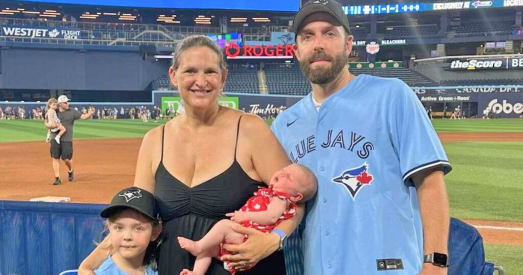 A family photo of Helen and Michael Green with daughter Darcy and newborn Olivia after her surprise birth in Canada.