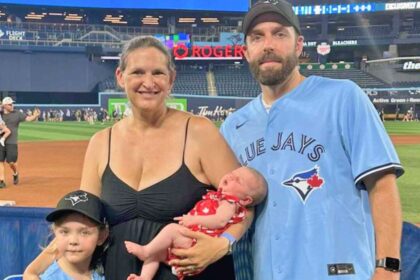 A family photo of Helen and Michael Green with daughter Darcy and newborn Olivia after her surprise birth in Canada.
