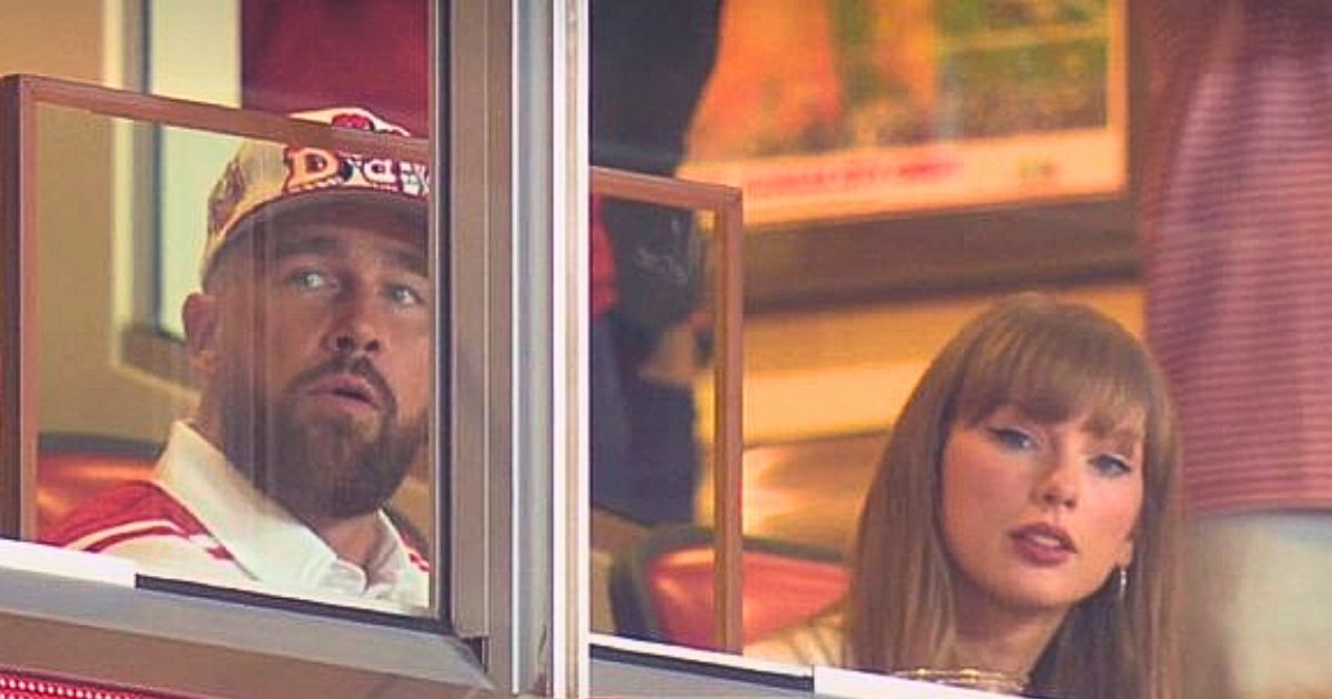 Taylor Swift and Travis Kelce sitting together at a college football game after announcing their engagement.