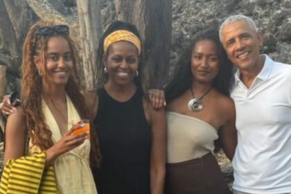 Barack Obama with his daughters and wife
