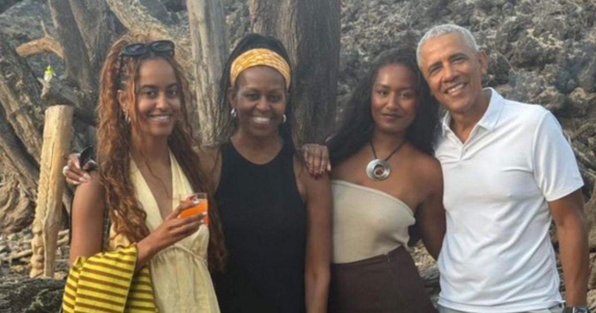 Barack Obama with his daughters and wife