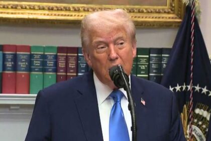 Donald Trump at a press podium making remarks about Democrats and Tylenol.