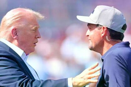 Donald Trump at the Ryder Cup speaking with golfer Keegan Bradley as shutdown looms