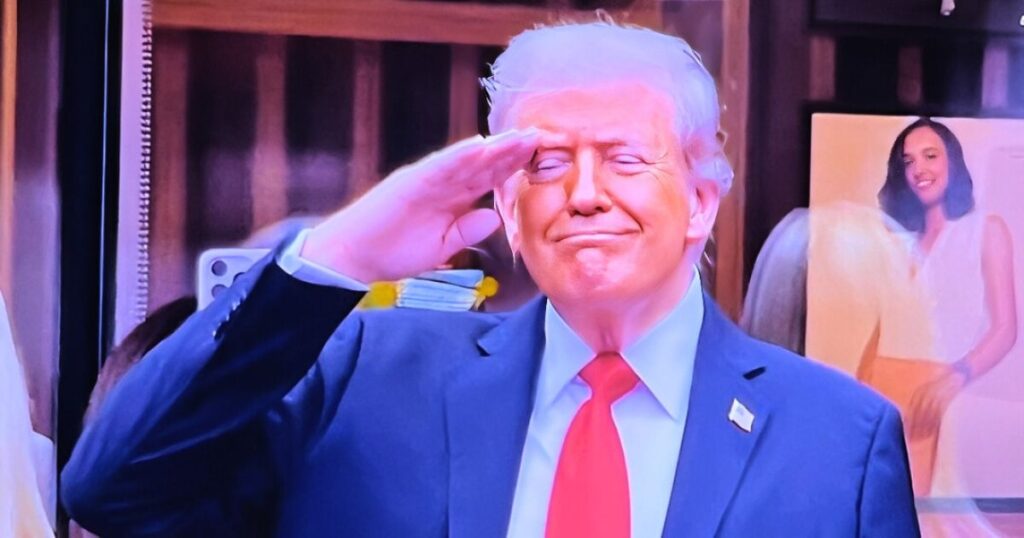 Donald Trump smirks after being booed during the U.S. Open men’s final.