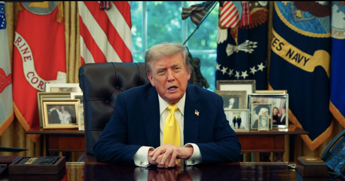 Donald Trump covers his bruised hand.