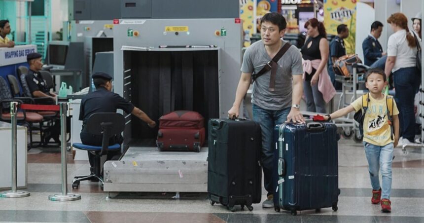 A popular luggage feature designed to keep travelers powered up is now facing bans at airports by TSA. (Photo by CEphoto, Uwe Aranas- via Wikimedia Commons).