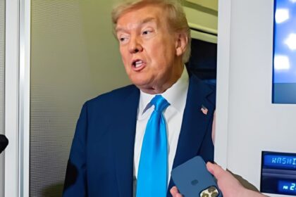 Donald Trump aboard Air Force One announcing increased tariffs on Canada