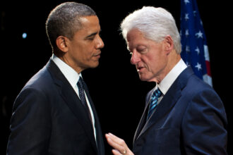 Former presidents Barack Obama and Bill Clinton talking