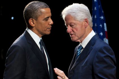 Former presidents Barack Obama and Bill Clinton talking