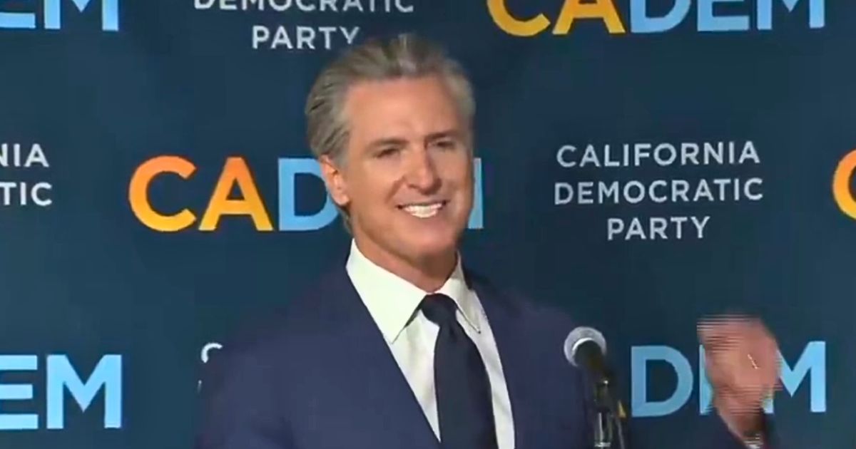 California Governor Gavin Newsom cheers after Prop 50 passes