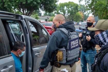 ICE agent reportedly pulls a firearm on a female motorist amid warning of imposters from FBI