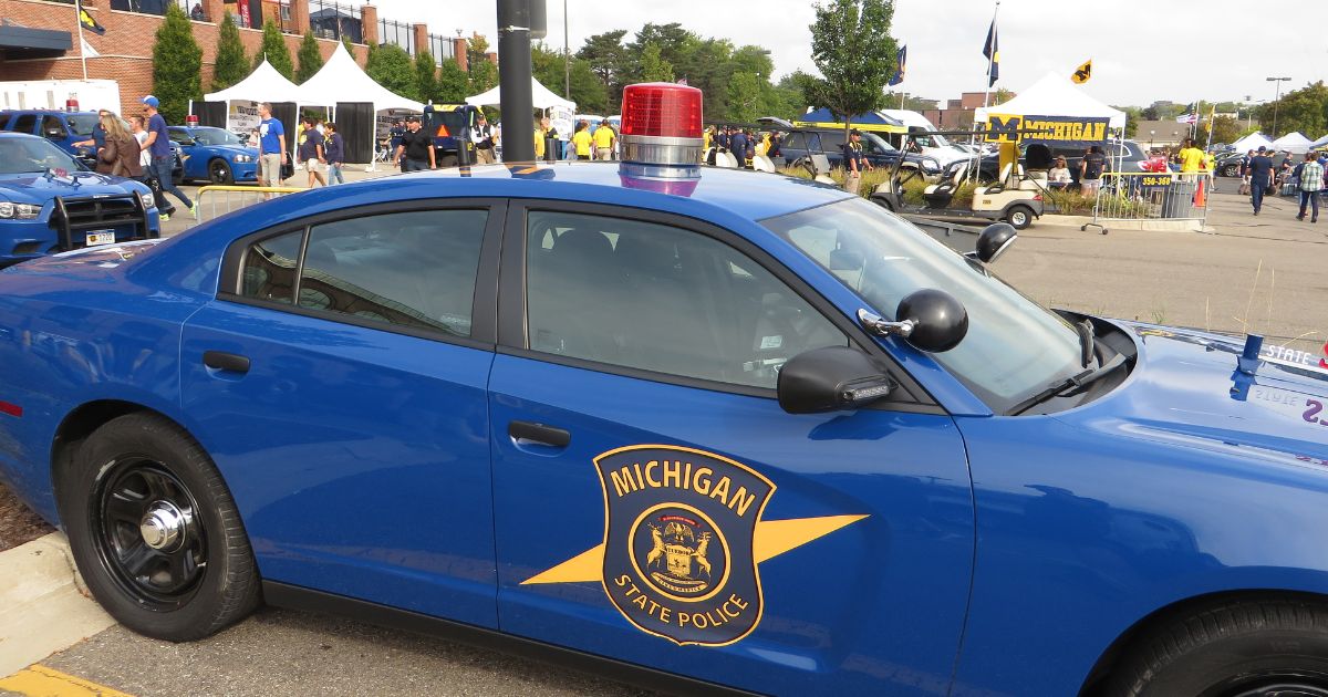 Freshman police officer helps Michigan woman deliver baby at the side of road with help from dispatcher brother