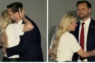Erika Kirk hugging JD Vance closely during a Turning Point USA event in Oxford, Mississippi
