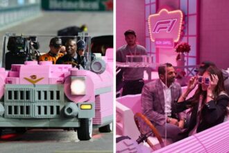 Kash Patel and Kristi Noem sit in a full-scale pink Lego Cadillac ahead of the Las Vegas Grand Prix