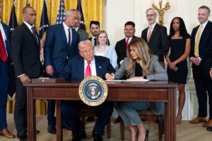 Melania and Donald Trump signing executive orders