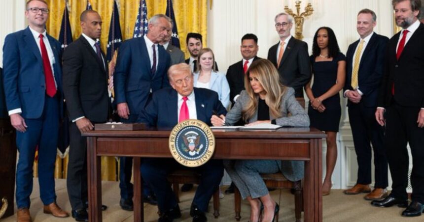 Melania and Donald Trump signing executive orders