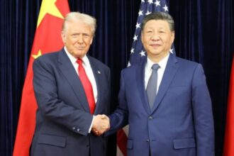 President Donald Trump shaking China President Xi Jinping's hand