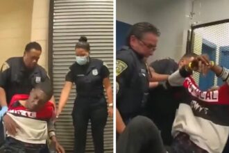 Cops dragging Black man into a cell immediately after a severe injury