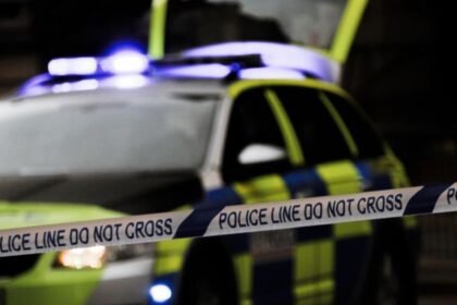 Man booked for pointing a gun towards a group of children singing Christmas carols at his door