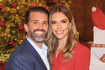 Donald Trump Jr. and Bettina Anderson pose together at the Trump Tower Christmas party in New York