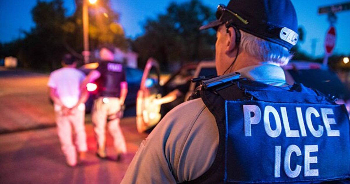 ICE Officials arrest a woman for allegedly spitting on them