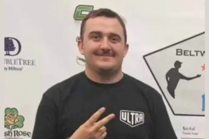 National Guardsman Andrew Wolfe showing a sign