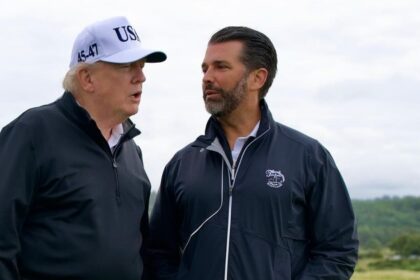 President Donald Trump’s onstage jab at AmericaFest puts his son Don Jr. on the spot. (@KUWTTRUMPS- X.com).