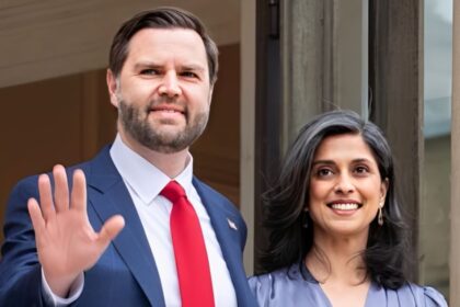 Vice President JD Vance is standing beside his wife, Usha Vance, during a public appearance
