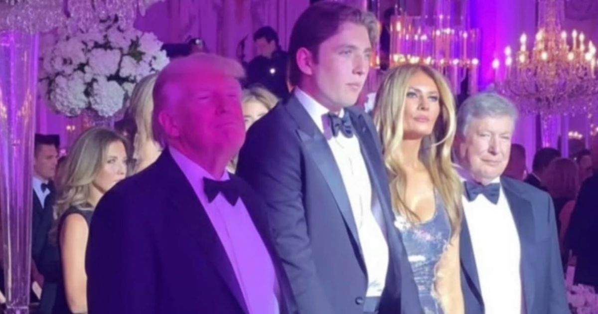 Barron Trump with his parents at Mar-a-Lago