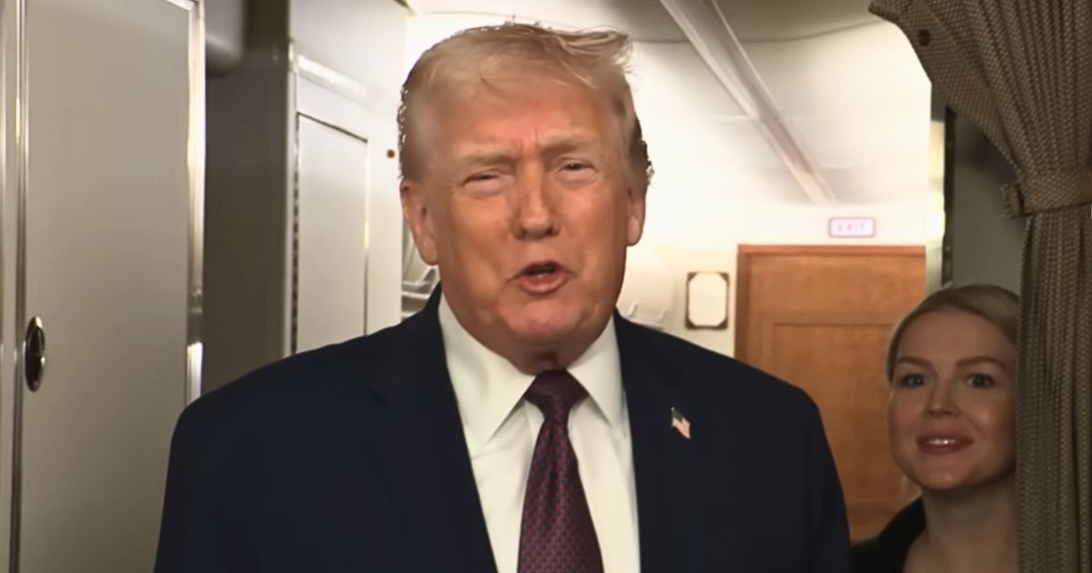 Donald Trump addressing reporters on Air Force One during a turbulent flight in January 2026