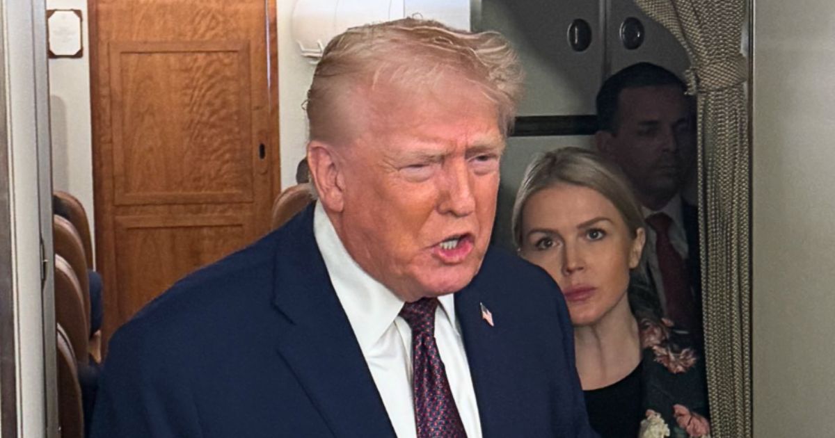 Donald Trump addressing the press on Air Force One while discussing Greenland and national security