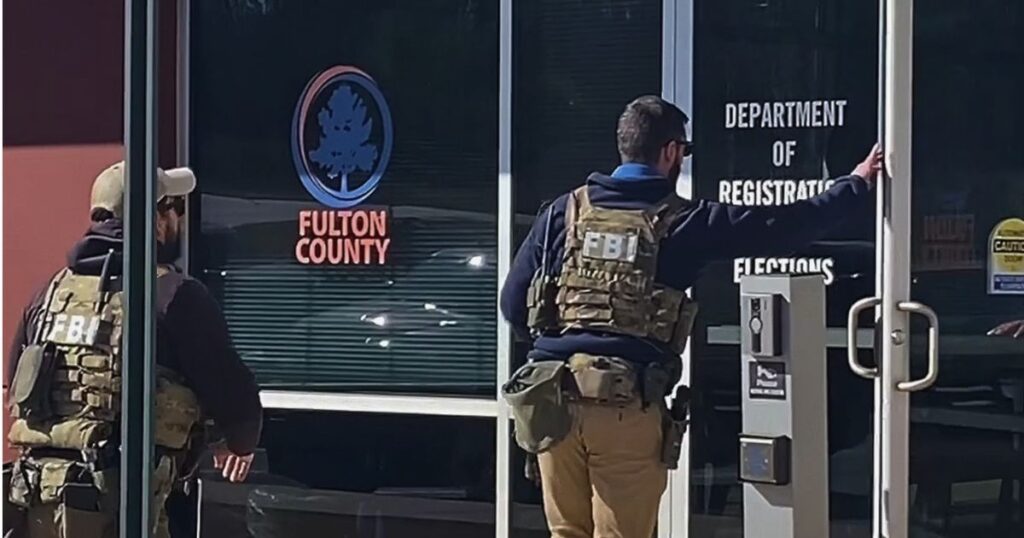 FBI agents carried boxes of ballots out of the Fulton County elections office in Georgia