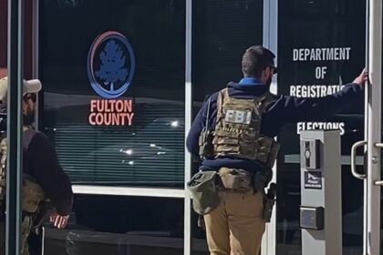 FBI agents carried boxes of ballots out of the Fulton County elections office in Georgia