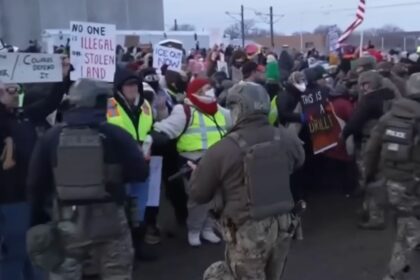 Protesters in Minneapolis form an Anti-ICE barrier after Renee Good's shooting.