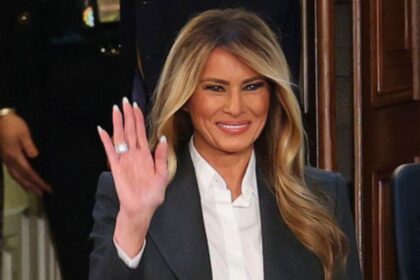 Melania Trump wearing a plain black pantsuit and white shirt at the 2026 State of the Union