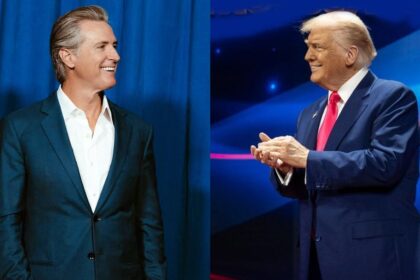 Gavin Newsom reacts to a new banner placed on the DOJ building in Washington DC