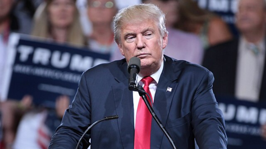 Donald Trump DJs after a woman faints at his rally